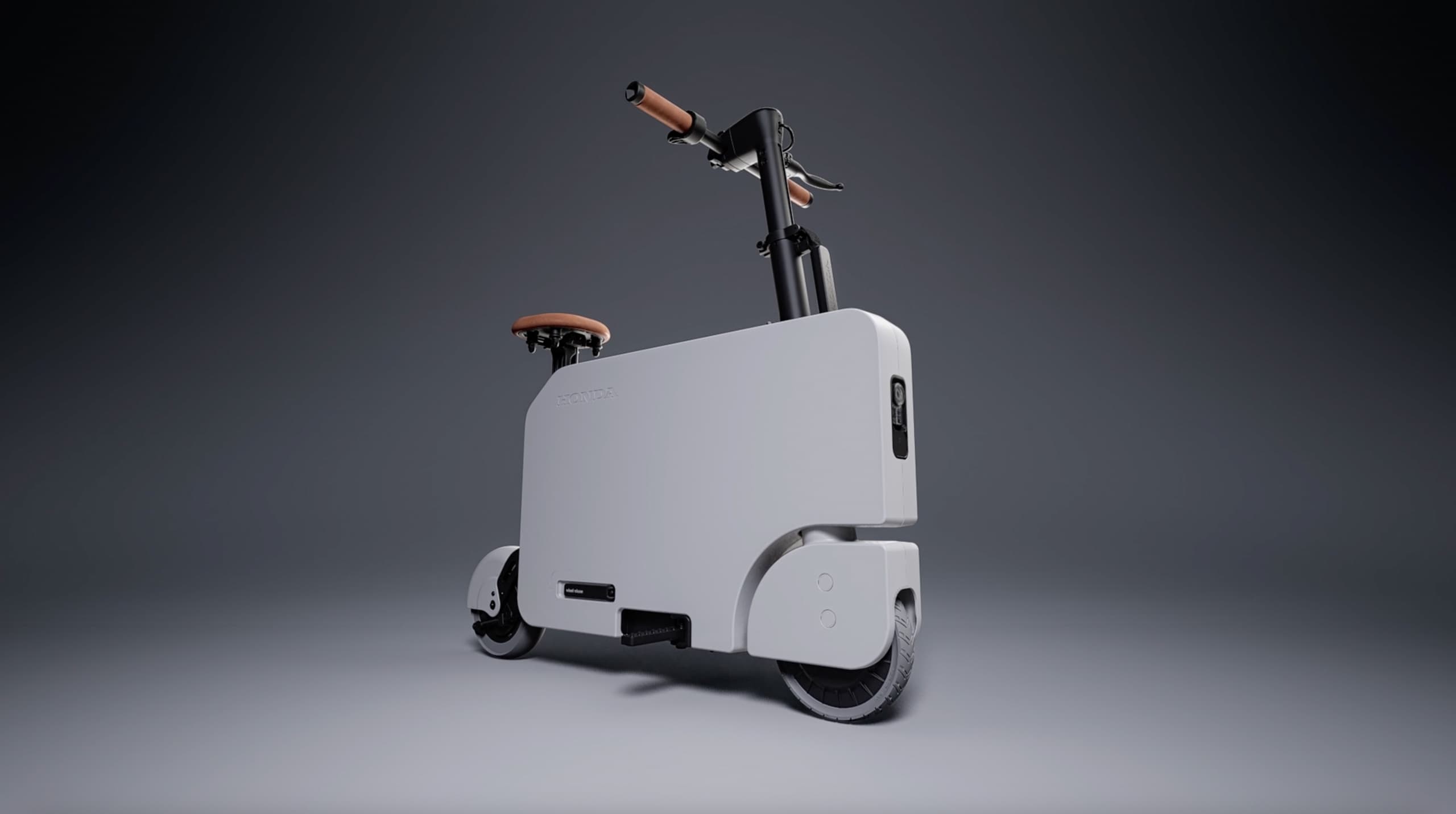 A modern, white electric scooter with a large rectangular body and tan leather seat and handlebars, displayed against a grey background.